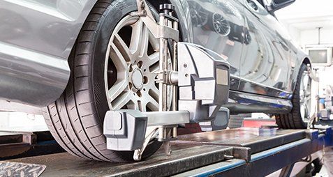 Drivelines — Tire Clamped With Aligner in Toughkenamon, PA Drivelines — Tire Clamped With Aligner in Toughkenamon, PA