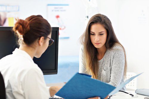 Woman Having A Visit At Female Doctor's Office — Saginaw, MI — Barry, Ronald C MD