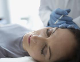 A woman receiving a cosmetic injection in Midland, MI A woman receiving a cosmetic injection in Midland, MI