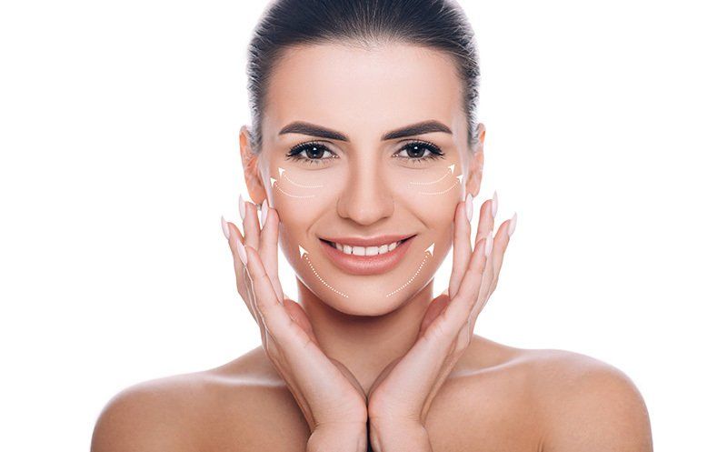 Smiling Woman with Lifting Arrows on Face — Saginaw, MI — Ronald C. Barry MD