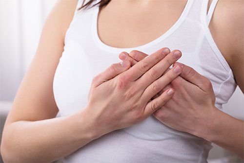 Woman Experiencing Breast Pain