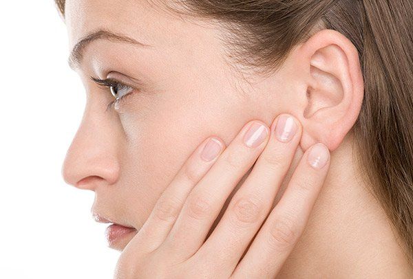 Woman Touching Her Ear