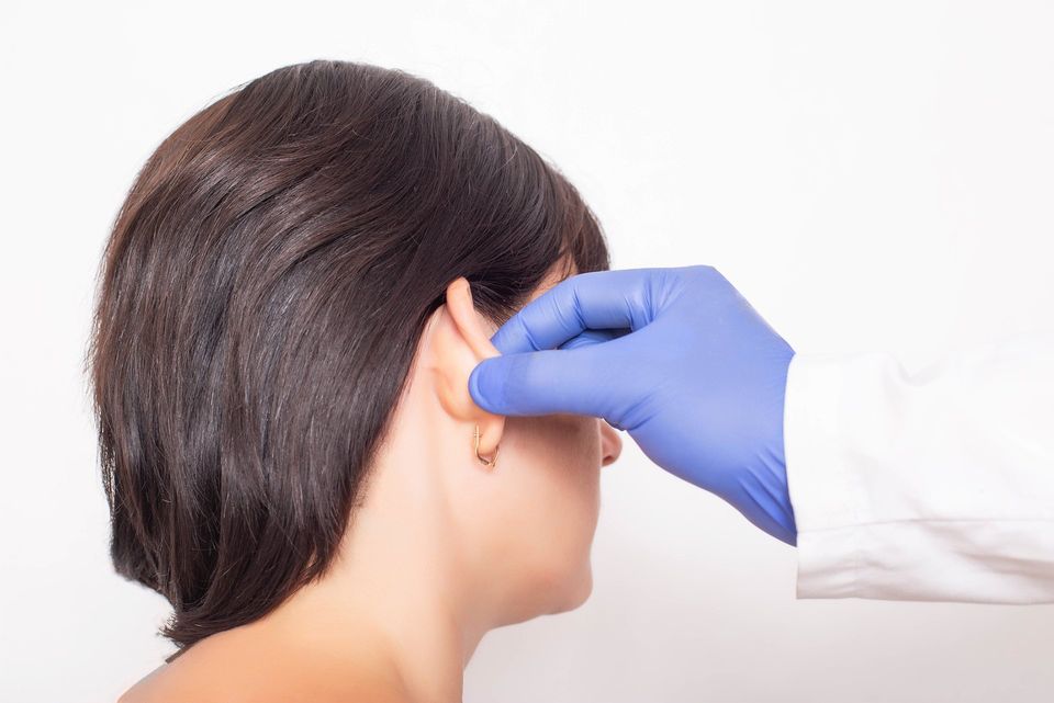 Doctor Examines a Patient's Girl's Ears — Saginaw, MI — Barry, Ronald C MD