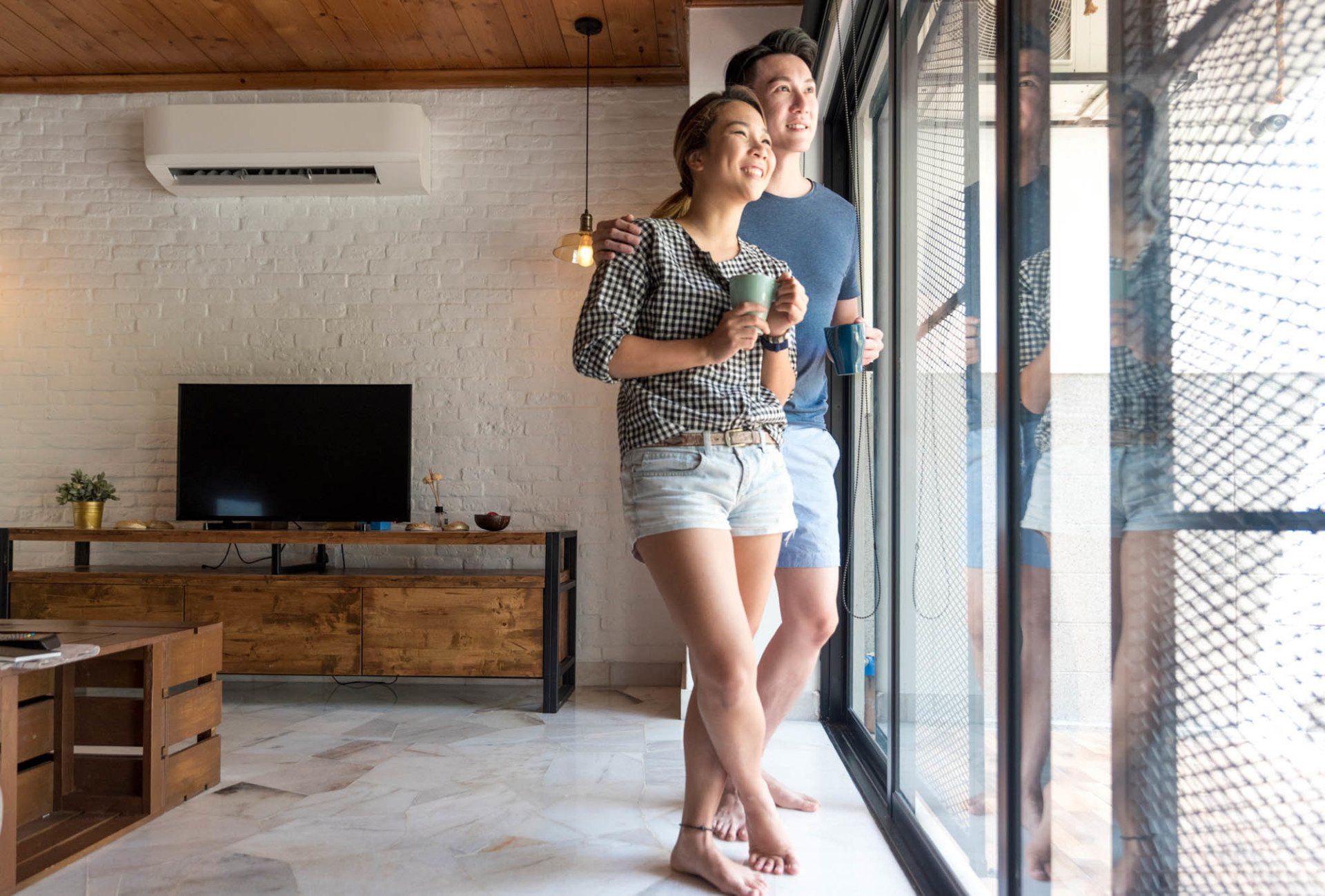 young couple at home smiling