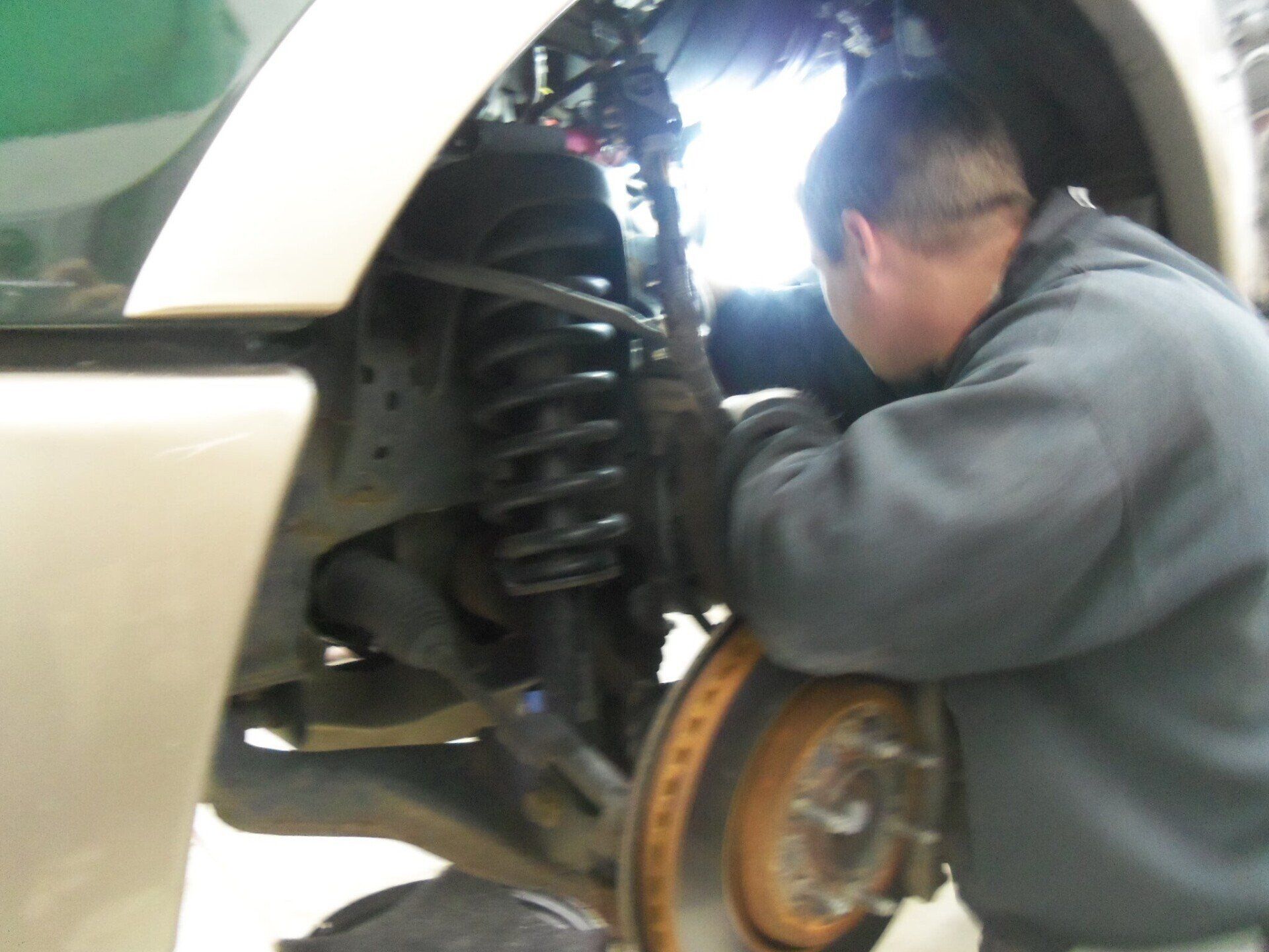 Mechanic Working on SUV — Villas, NJ — John's Auto Body