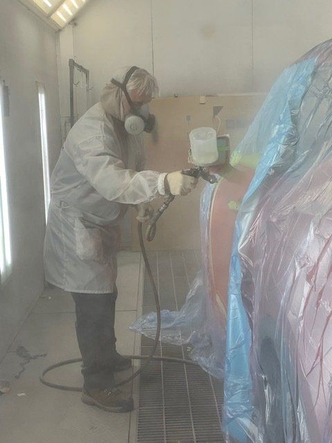 Man Working in Car Painting Booth — Villas, NJ — John's Auto Body