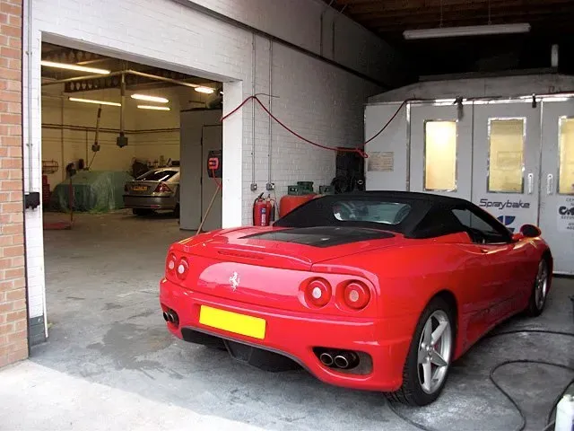 Red sports car being resprayed