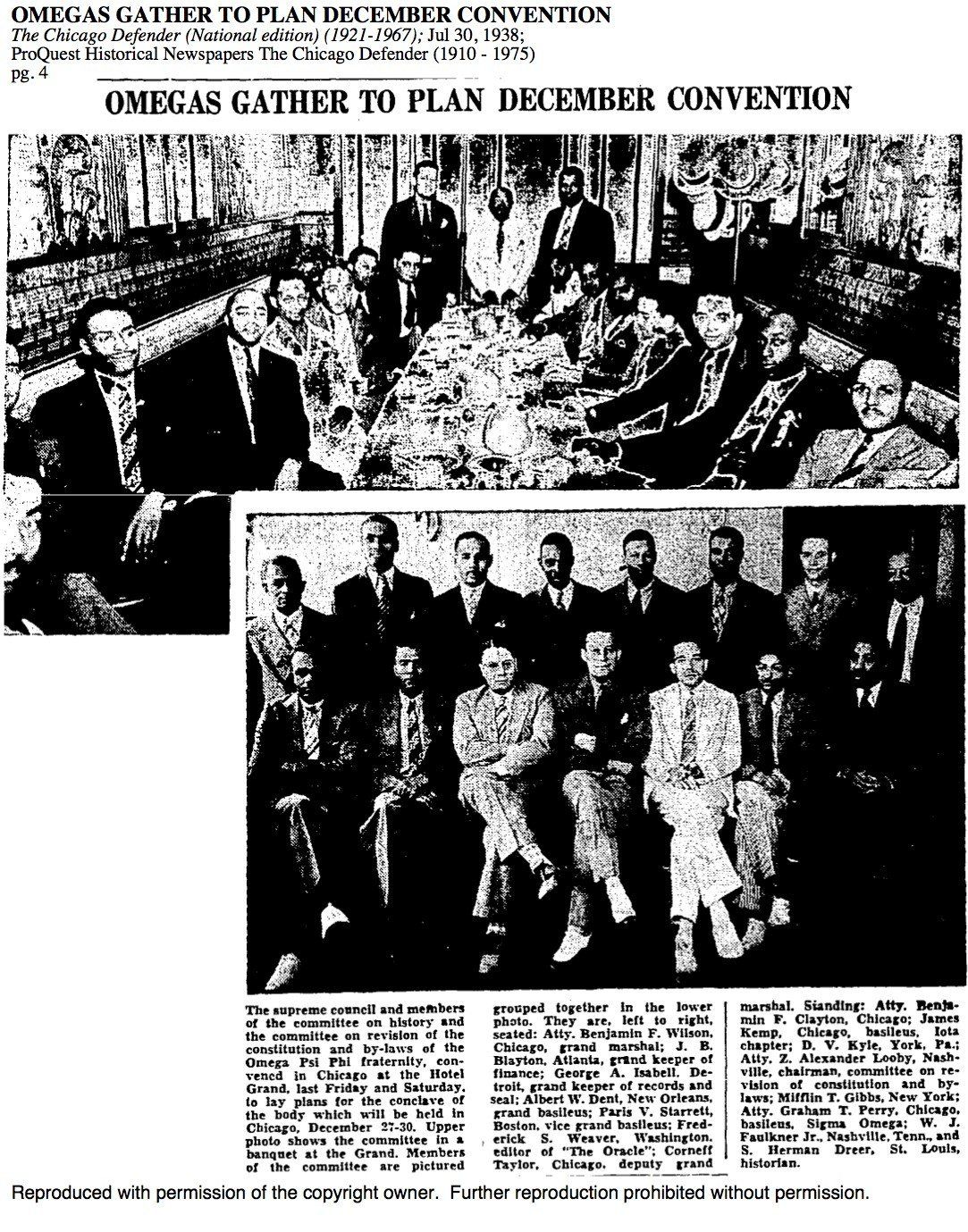 A black and white photo of a group of people sitting around a table.