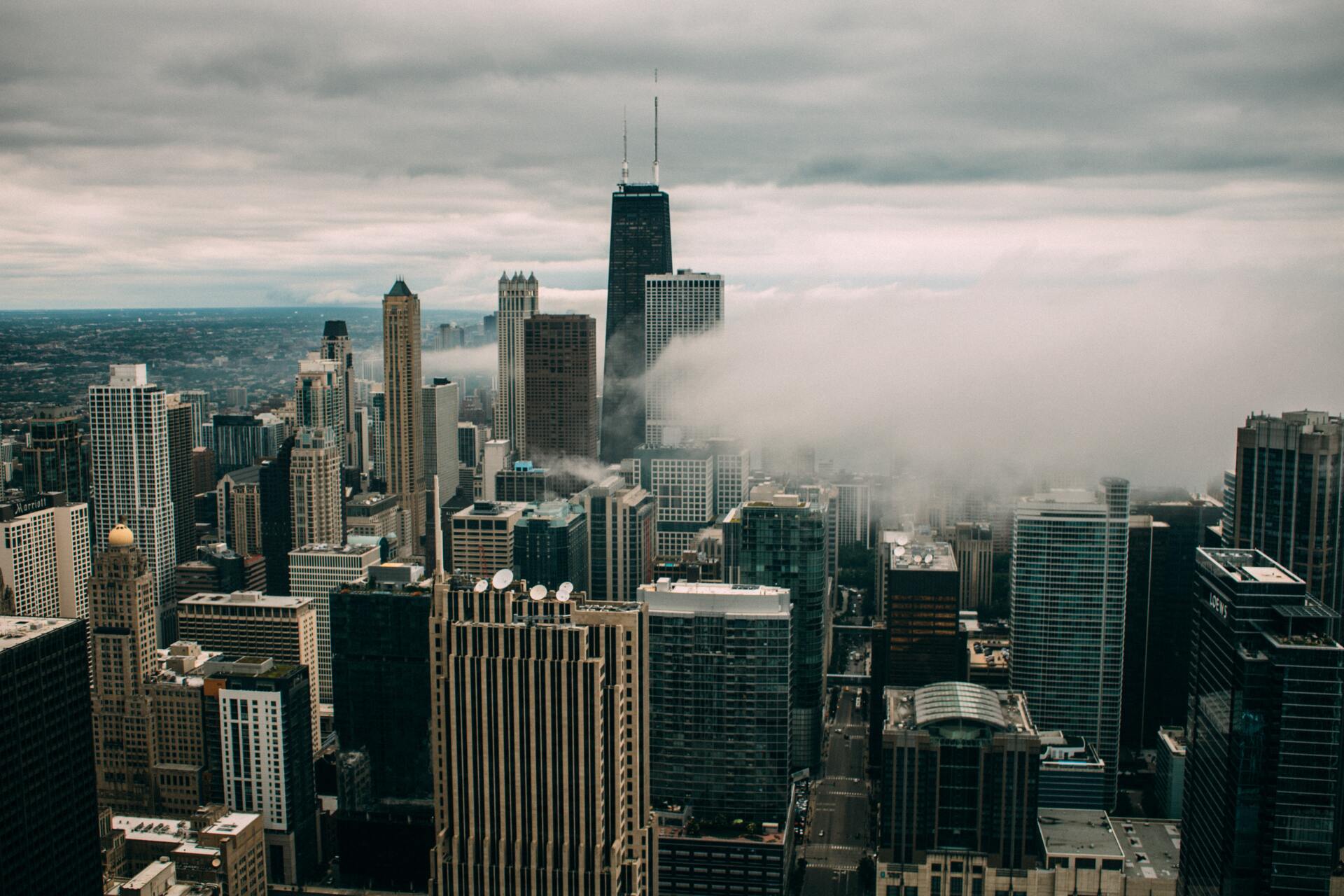 An aerial view of a city skyline on a cloudy day.