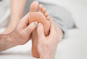 A close up of a reflexology massage