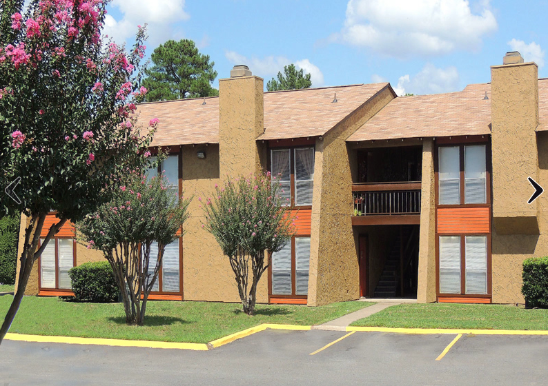 An exterior image of Kingwood Forest with parking spaces