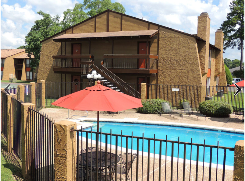 A view of the pool and patio table umbrella