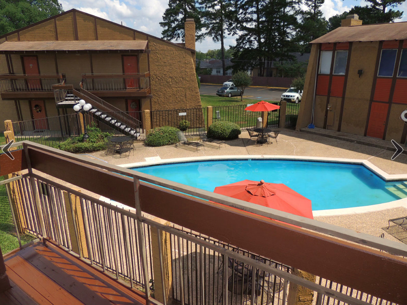 view of the pool from a unit's balcony