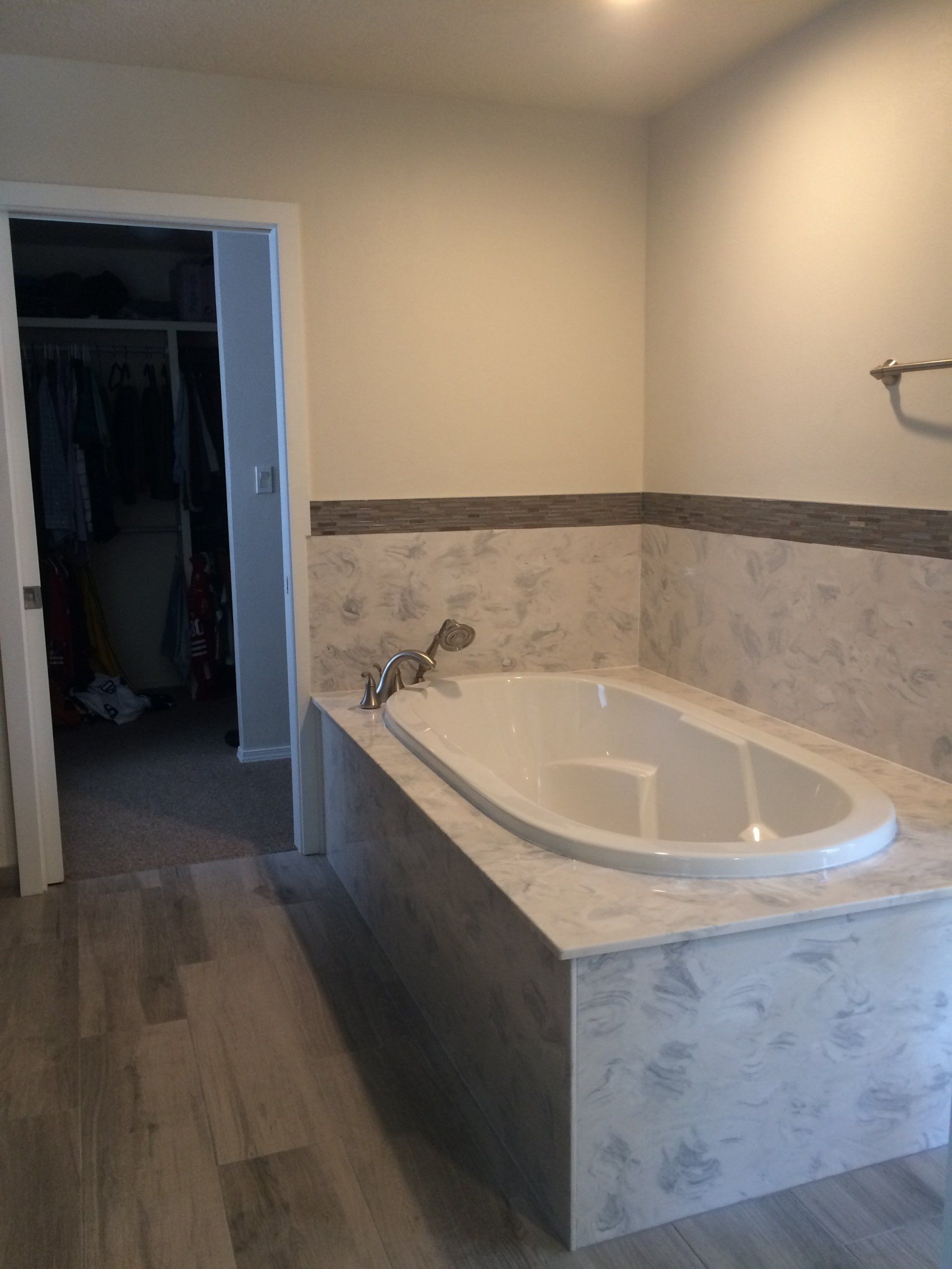 There is a bathtub in the middle of the bathroom.