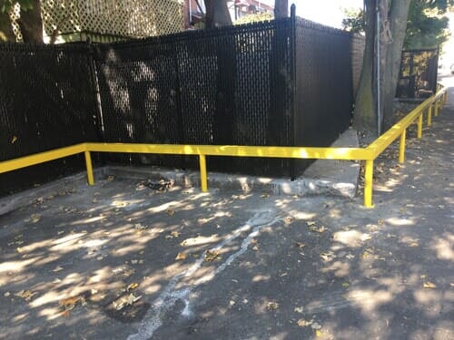 Yellow guard rail—Security Fence in Bronx, NY