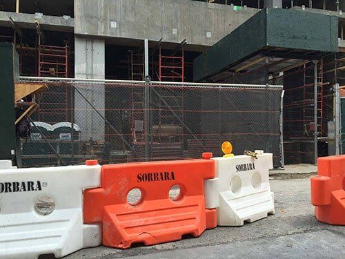 Building under construction with a temporary fence—Security Fence in Bronx, NY