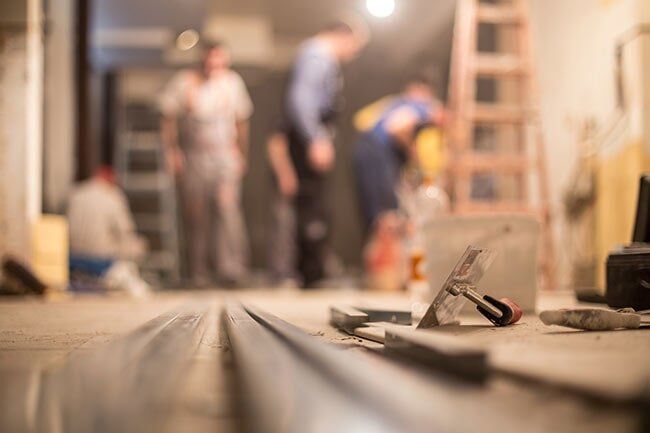 Construction Workers Renovating Interior — Floor Repair in Gales Ferry, CT