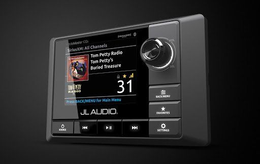 A jl audio radio with a black background and a black screen.