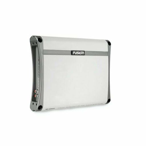 A white amplifier is sitting on a white surface.