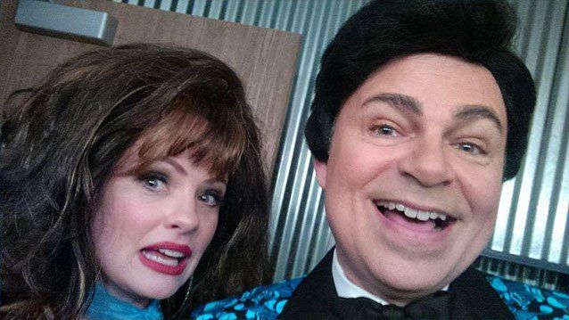 Women wearing brown wig and man in dark wig onstage