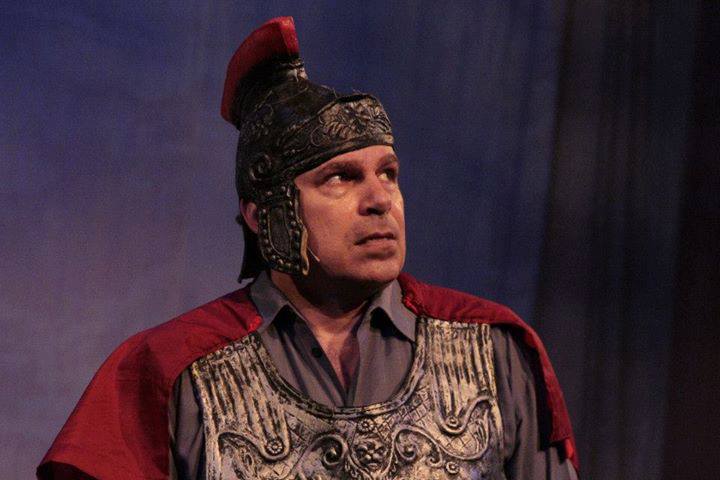 Man wearing gladiator costume and hat
