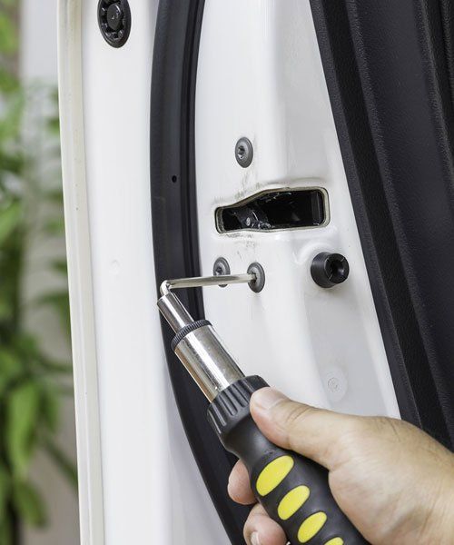 Auto locksmith servicing a vehicle in Greensboro, NC