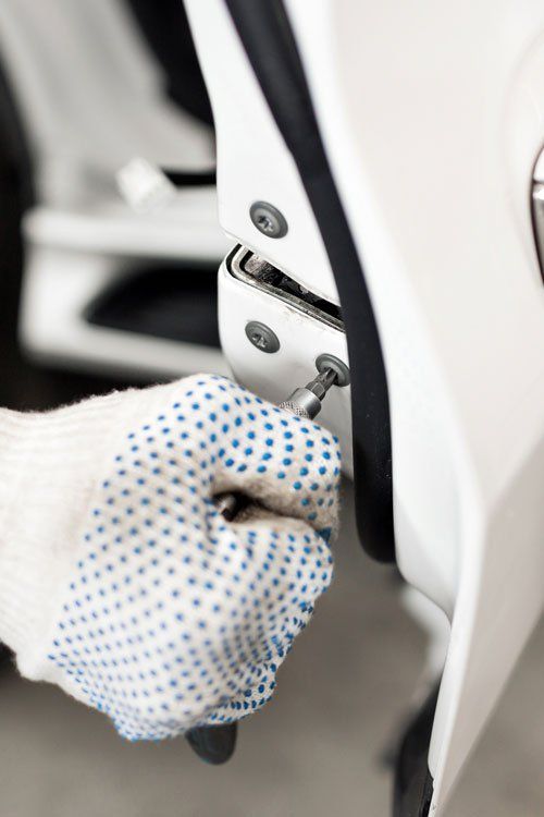 Auto locksmith unlocking a car