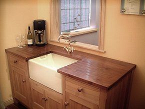 Looking for a carpenter you can rely on? We can help Traditional wooden cabinets with white sink