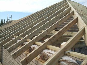 Contact us for expert joinery services in Lincoln Wooden roof beams during roof installation