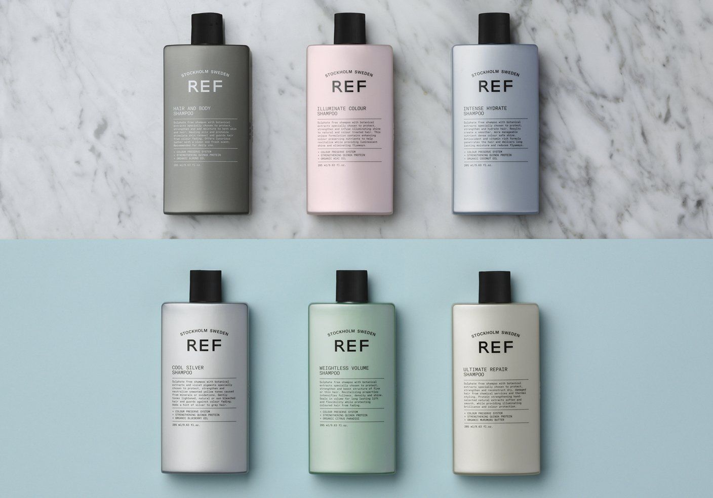 Six bottles of REF haircare products in various pastel colors on a marble and blue surface.