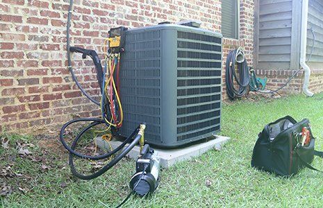 Air Conditioning Repair — Air Conditioner Maintenance with Gauges and Vacuum Pump in Concord, NC Air Conditioning Repair — Air Conditioner Maintenance with Gauges and Vacuum Pump in Concord, NC