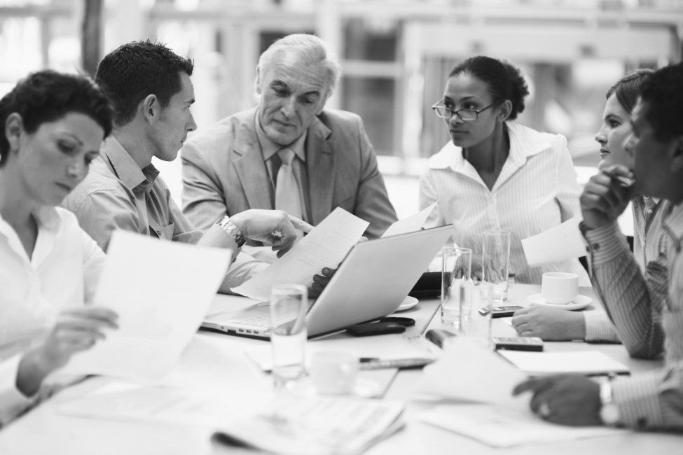 An association management team working together