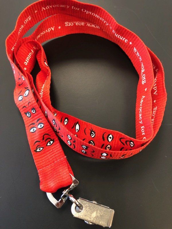 A red lanyard with a cartoon face on it
