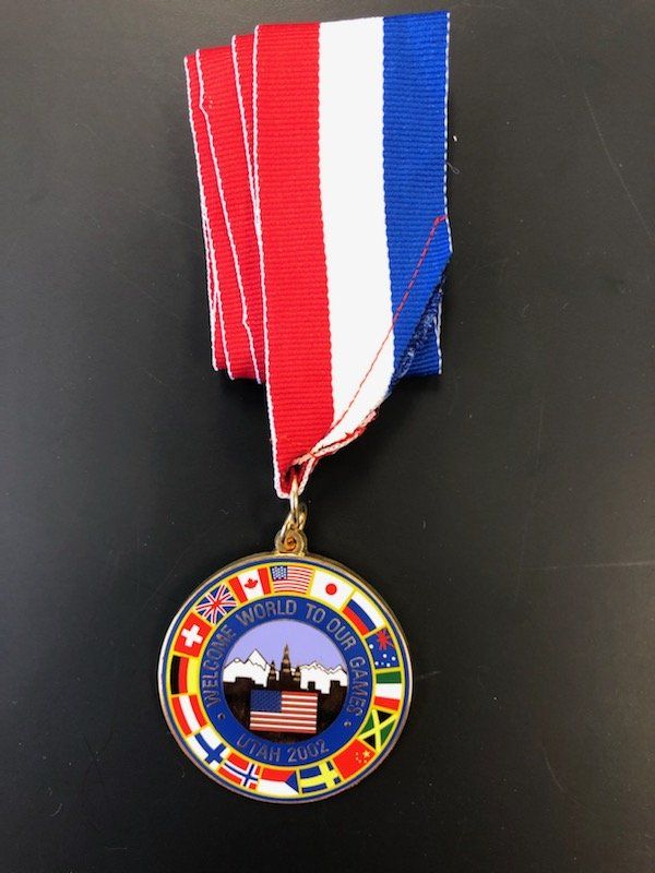 A medal with the word world on it