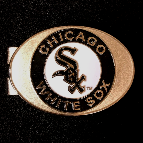 A chicago white sox belt buckle on a black background