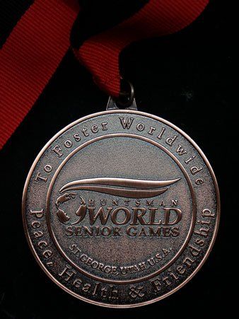 A medal that says to foster worldwide on it