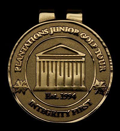 A gold coin that says plantations junior golf tour integrity first