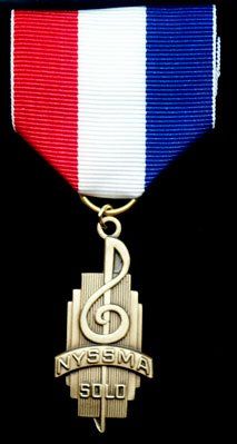A medal with a treble clef and the words nyssma solo on it