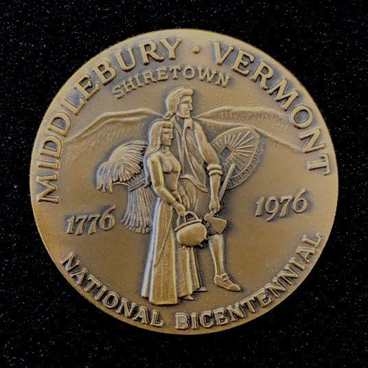 A bronze coin commemorates the bicentennial of middlebury vermont