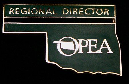 A pin that says regional director opea on it