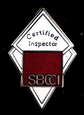 A pin that says certified inspector sbcci on it