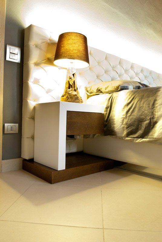 letto con testiera capitonné