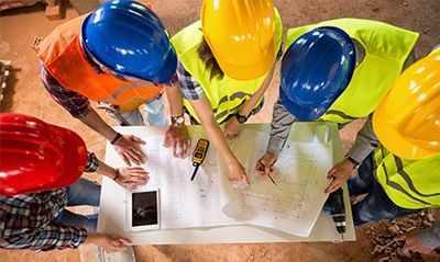 Workers Checking Blue Print - Builders & Contractors in Easton, MD