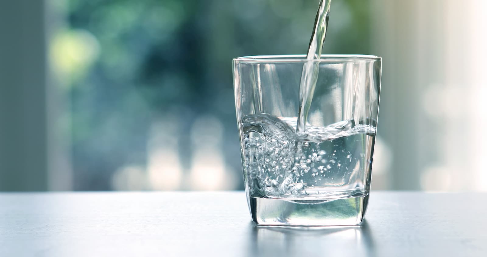 Water Getting Poured into Glass