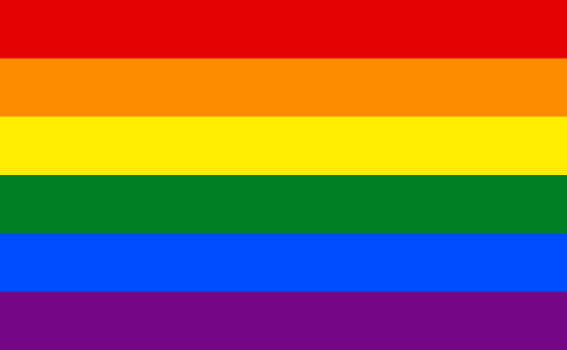A close up of a rainbow flag on a white background.