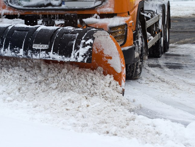 Plow removing snow