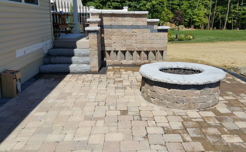 Brick fire pit on the patio.