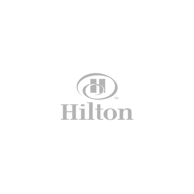 Hilton logo with the Hilton wordmark beneath a stylized double-H icon within an oval.