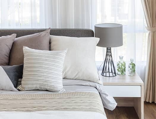 modern style bedroom with pillows on bed
