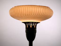 Orange ribbed glass ceiling light on a black lamp base